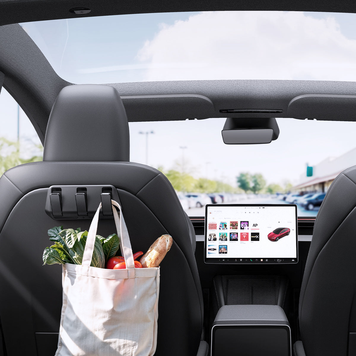 ACP09201 - Tesla Model 3 (2017-2023) Car Seat Hook TO283 in Black showing the front of the vehicle, with grocery bag hanging on the hook