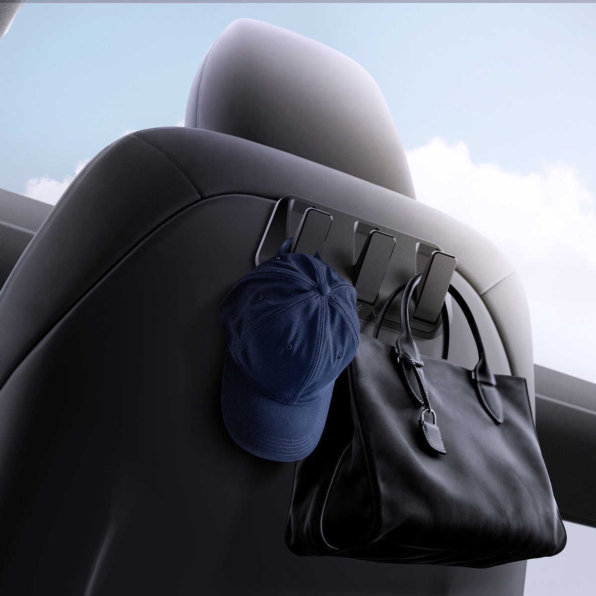 ACP09201 - Tesla Model 3 (2017-2023) Car Seat Hook TO283 in Black showing the front partial bottom with stuffs hanging on the hook