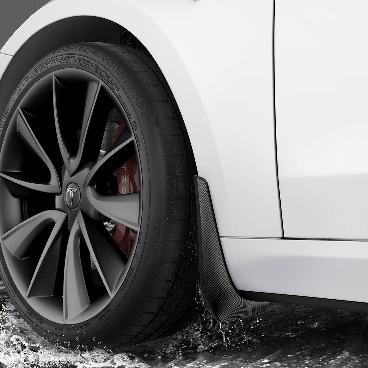 ACP04511 - Tesla Model 3 WeatherBloc Mud Flaps showing the mud flaps installed and water hitting it
