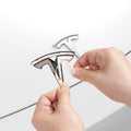 ACP08547 - Tesla Model 3 Highland Front Emblem Logo Cover TO321H in Black showing the peeling of the film sticker