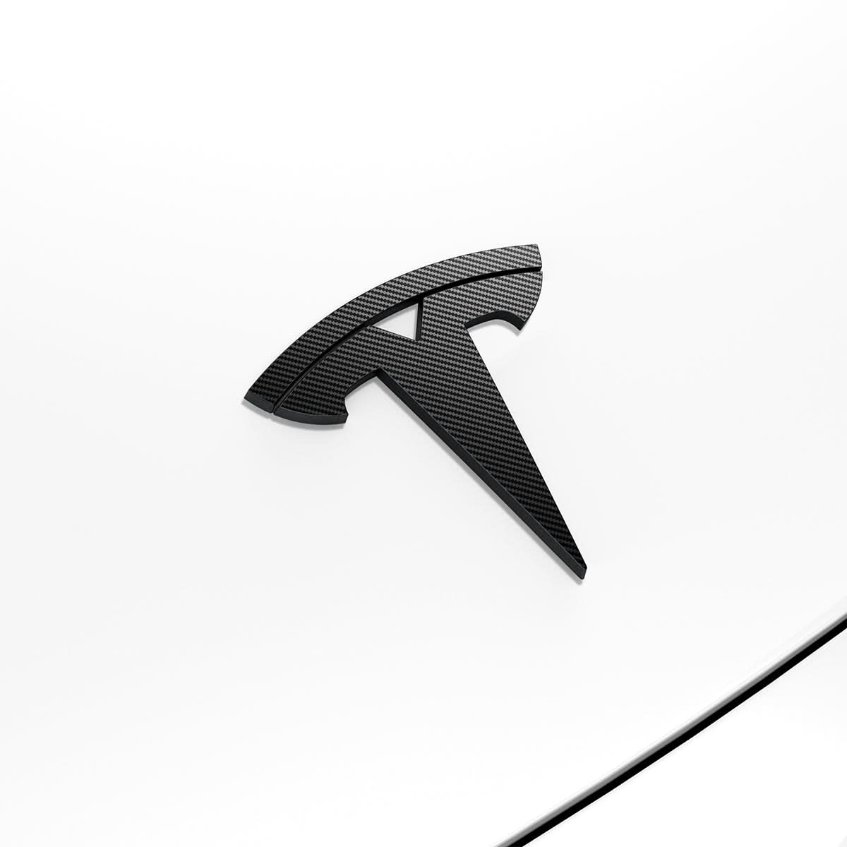 ACP08548 - Tesla Model 3 Highland Front Emblem Logo Cover TO321H in Carbon showing the front and sides