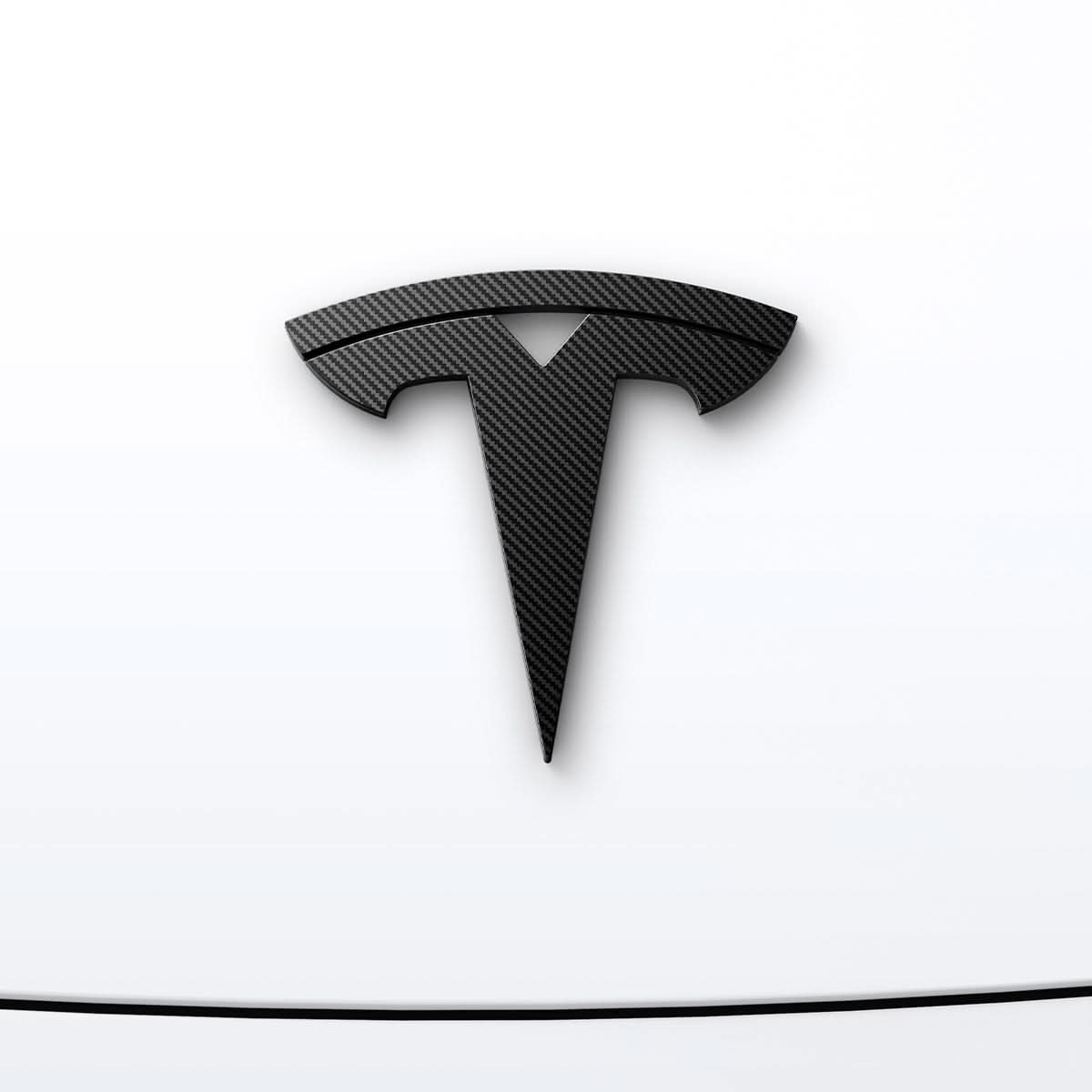 ACP08548 - Tesla Model 3 Highland Front Emblem Logo Cover TO321H in Carbon showing the front