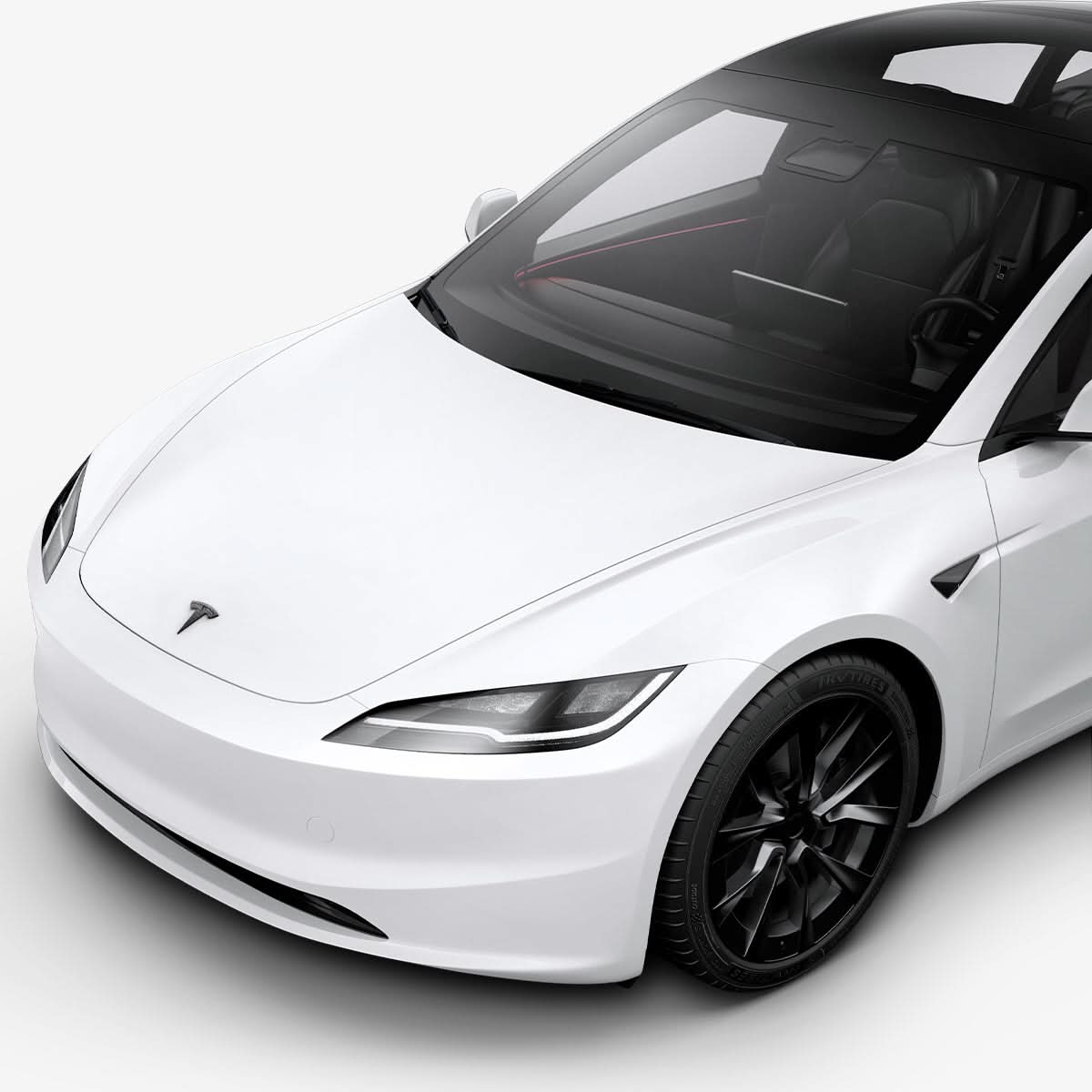 ACP08548 - Tesla Model 3 Highland Front Emblem Logo Cover TO321H in Carbon showing the attached to the front of the tesla car on a side view