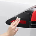AFL07573 - Tesla Model X Charging Port Protective Film TO422 in Transparency showing the wiping of the charging area before installation