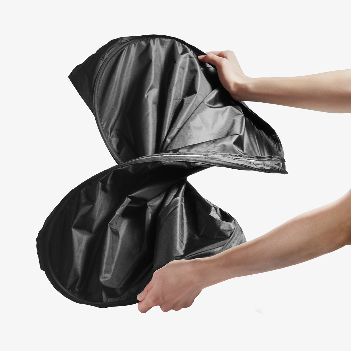 ACP11460 - Universal CryoShade UO260 M showing hands twisting sunshade into figure-eight shape during folding process
