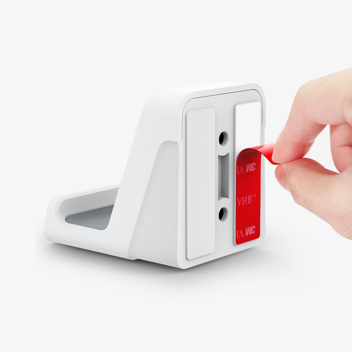 AMP06397 - PlayStation 5 Controller Mount | VG300 in White showing the back, partial side and bottom while slowly pulling out the adhesive sticker