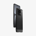 ACS05325 - Xiaomi 13 Pro Rugged Armor Case in Matte Black showing the back, partial side, hovering behind a device showing partial front and side