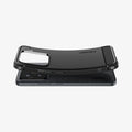 ACS08859 - Xiaomi 15 Case Rugged Armor in Matte Black showing the 
the back, partially bent while hovering above the device