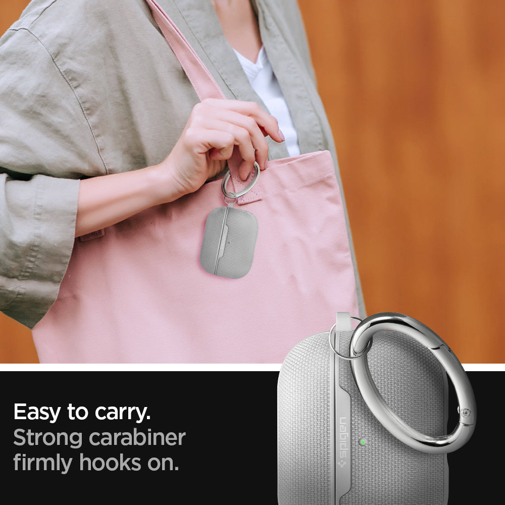 ASD00573 - Apple AirPods Pro Case Urban Fit in gray showing how it is easy to carry. Strong carabiner firmly hooks on