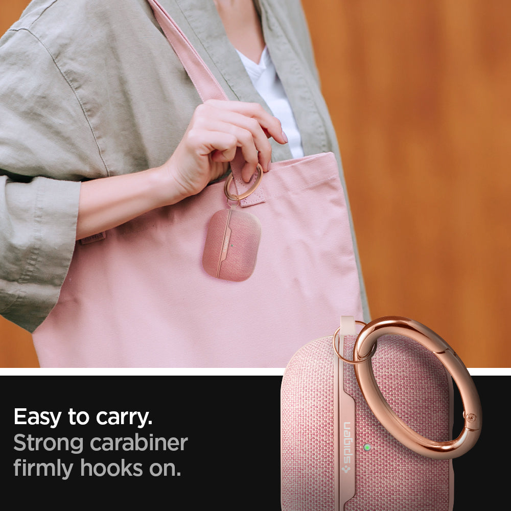 ASD00575 - Apple AirPods Pro Case Urban Fit in rose gold showing how it is easy to carry. Strong carabiner firmly hooks on