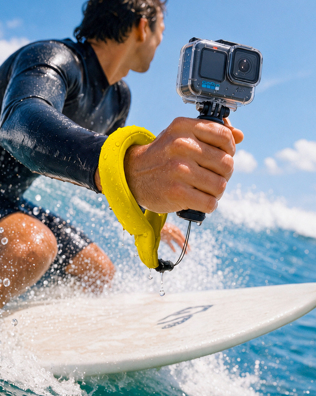  AMP11843 - Aqua Shield Floating Strap in Neon Yellow showing a person wearing a floating wrist strap while holding an action camera in the water