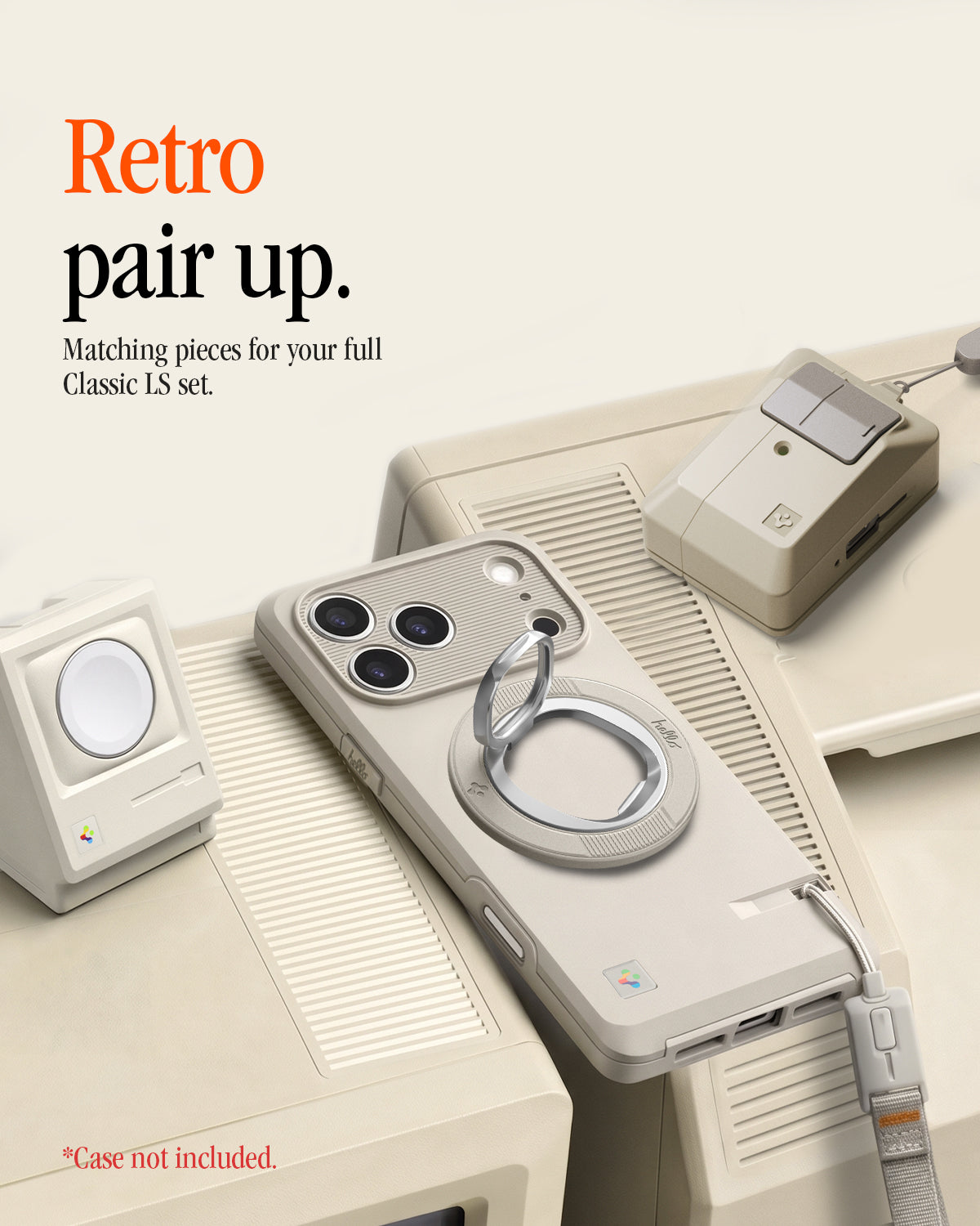 AMP11738 - Spigen Classic LS MagFit Ring on a phone displayed alongside matching cream retro-styled AirTag case and charger accessories designed to look like a vintage Macintosh set
