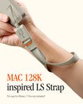 AFA10617 - DA30S LS lanyard strap worn on wrist attached to phone showing quick-release connector, woven fabric strap, and MAC 128K inspired LS Strap branding text