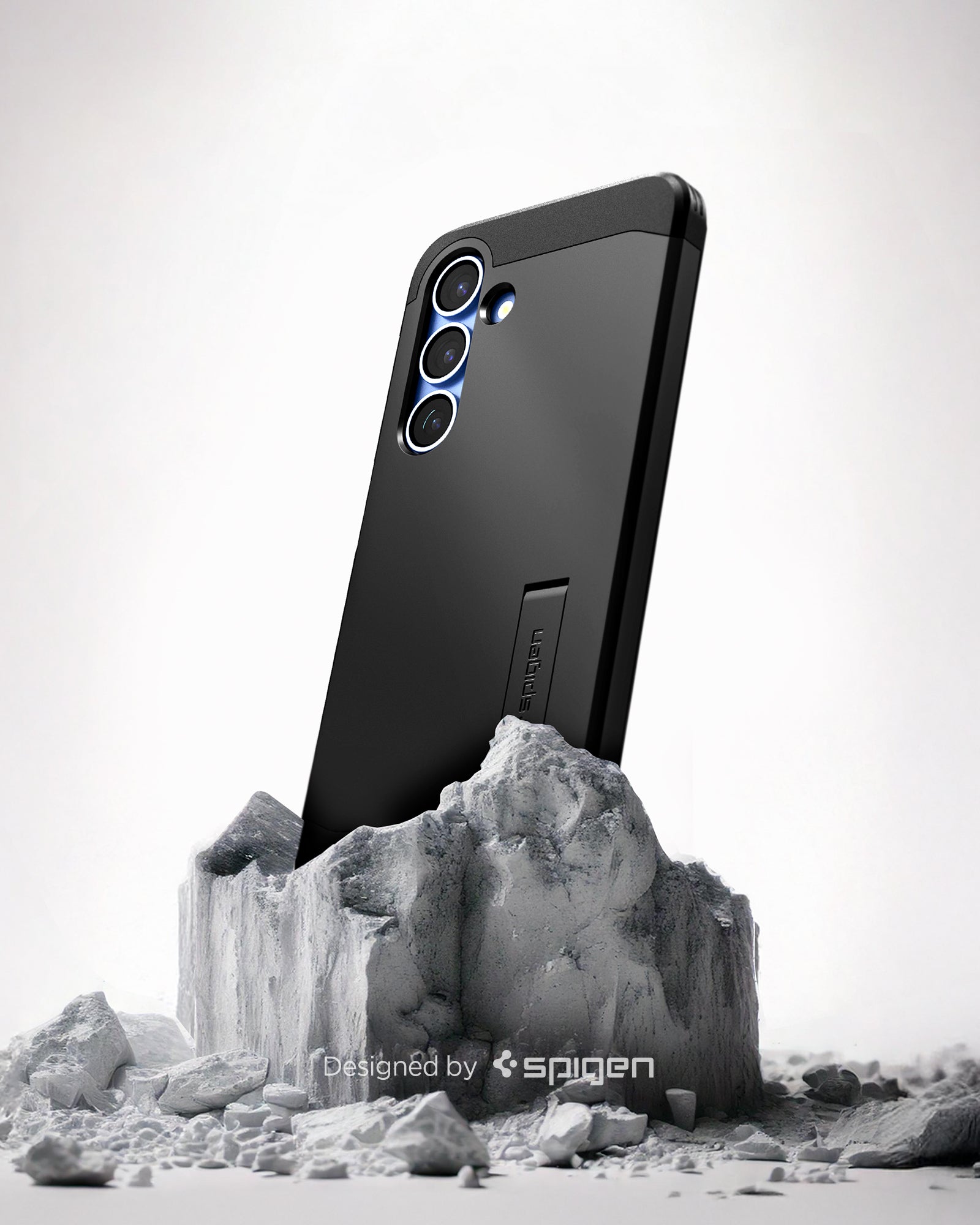 ACS09008 - Galaxy S25 Case Tough Armor AI (MagFit) in Black showing the back, partial side device sitting on the top of a rock