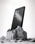 ACS08964 - Galaxy S25 Ultra Case Tough Armor AI (MagFit) in Black showing the back, partial side device sitting on the top of a rock