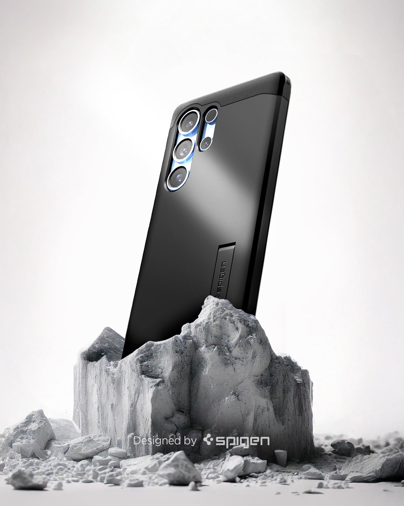 ACS08964 - Galaxy S25 Ultra Case Tough Armor AI (MagFit) in Black showing the back, partial side device sitting on the top of a rock