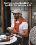 AMP11615 - Galaxy Watch Ultra Series - DuraPro Armor showing a lifestyle shot of a person wearing the Galaxy Watch Ultra with the DuraPro Armor band at an outdoor cafe.
