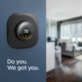 AHP03711 - Google Nest Learning Thermostat 3G Wall Plate in black showing the thermostat mounted to a wall