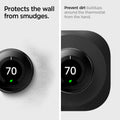 AHP03711 - Google Nest Learning Thermostat 3G Wall Plate in black showing how its protected from wall smudges. Prevent dirt buildups around the thermostat from the hand