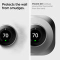 AHP03712 - Google Nest Learning Thermostat 3G Wall Plate in stainless steel showing how its protected from wall smudges. Prevent dirt buildups around the thermostat from the hand