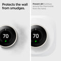 AHP03710 - Google Nest Learning Thermostat 3G Wall Plate in white showing how its protected from wall smudges. Prevent dirt buildups around the thermostat from the hand