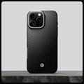ACS08151 - iPhone 16 Pro Case Enzo Aramid in Black Silver showing whole case on the rock.