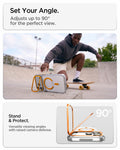 ACS11910 - iPhone 18 Pro Max / iPhone 17 Pro Max Ultra Hybrid Optik S (Mag Fit) Clear Orange showing the case propped horizontally with the camera ring stand for hands-free viewing
