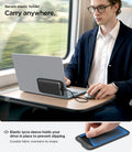 APP11228 - SSD/HDD Holder | LD221 in Black showing man using on laptop back panel during train commute with elastic lycra sleeve securing portable drive to prevent slipping