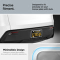 ACP12020 -  License Plate Frame | LP100 in White showing the precise fitment, designed to fit precisely on your license plate with style, carbon fiber, unique sporty accents for a stylish edge
