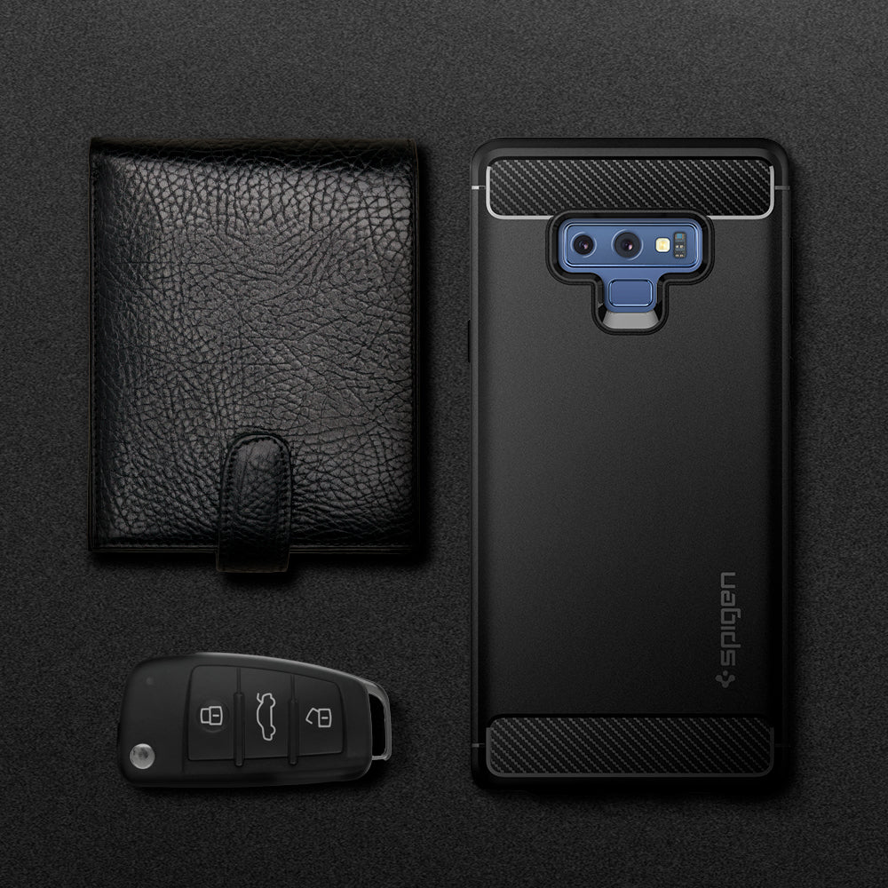 599CS24572 - Galaxy Note 9 Case Rugged Armor in matte black showing the back next to a black wallet and key