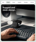 AMP11999 - Fitbit Air Night Stand | S356 in Black showing the charging stand holding a fitness band on a desk beside a keyboard