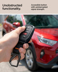 ACS11366 - Toyota Key Fob Cover | TK100 showing hand holding Toyota key fob cover in front of red Toyota SUV