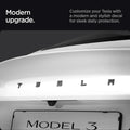 ACP08550 - Tesla Model 3 Highland Rear Emblem Logo Cover TO322H in Carbon showing the modern upgrade, customize your Tesla with a modern and stylish decal for sleek daily protection