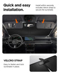 ACP11460 - Universal CryoShade UO260 M showing sunshade tucked behind sun visors inside car cabin with velcro strap detail and installation steps below