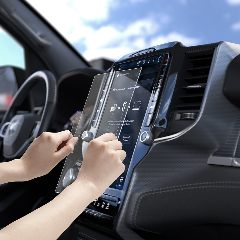 AGL04047 - Dodge Ram Screen Protector GLAS.tR SLIM Anti-Glare showing hands applying screen protector to Ram infotainment display inside truck cabin