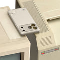 ACS10479 - iPhone 17 Pro Classic LS MagFit case resting on vintage Macintosh computers highlighting retro-inspired design and neutral finish
