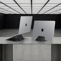 AMP11118 - Slim Fold Laptop Stand | Non-Adhesive | Black LD201-S9 showing one MacBook propped up for use and on the right MacBook vertically mount for storage