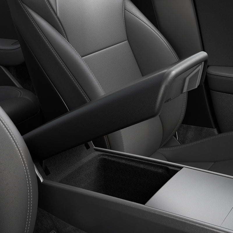 ACP07410 - Model 3 (2024) Armrest Cover TO240H in Black showing the front and partial side of an armest partially lifted up inside a car