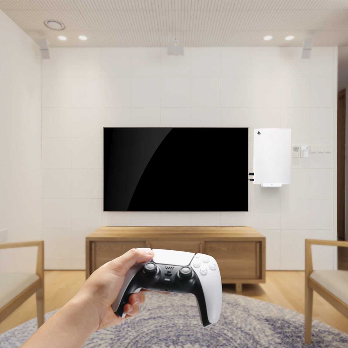 AMP06396 - Playstation 5 Console Mount | VG200 in white showing person's hand holding the controller while the console is attached to the wall using the mount