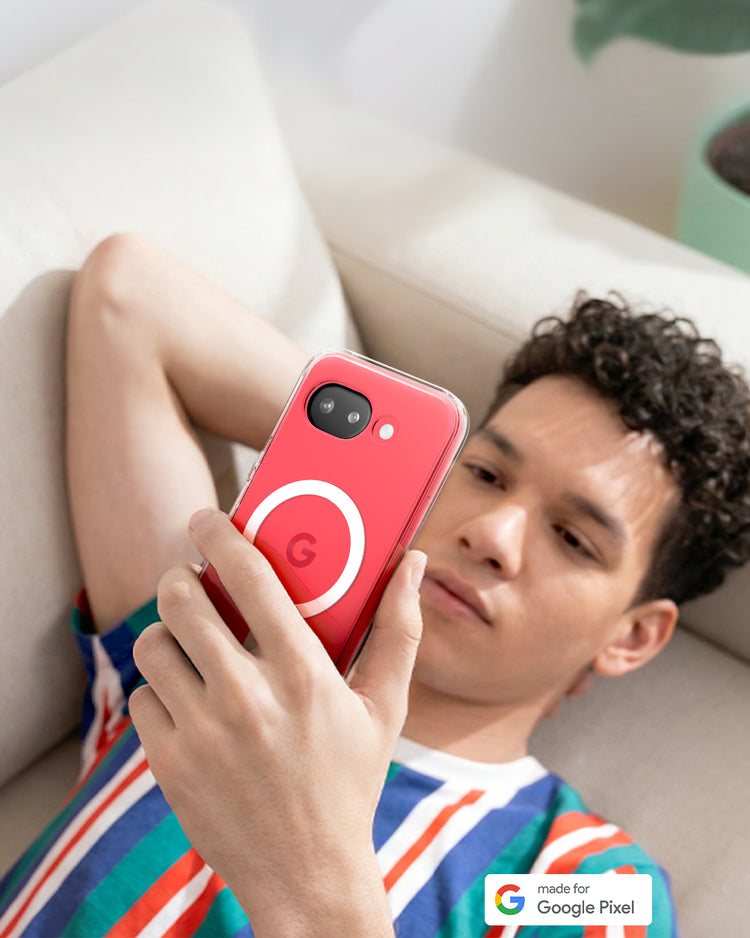 Person relaxing on a sofa holding Pixel 10a with Clear Case and circular MagFit ring design, lifestyle setting with side table and plant in background