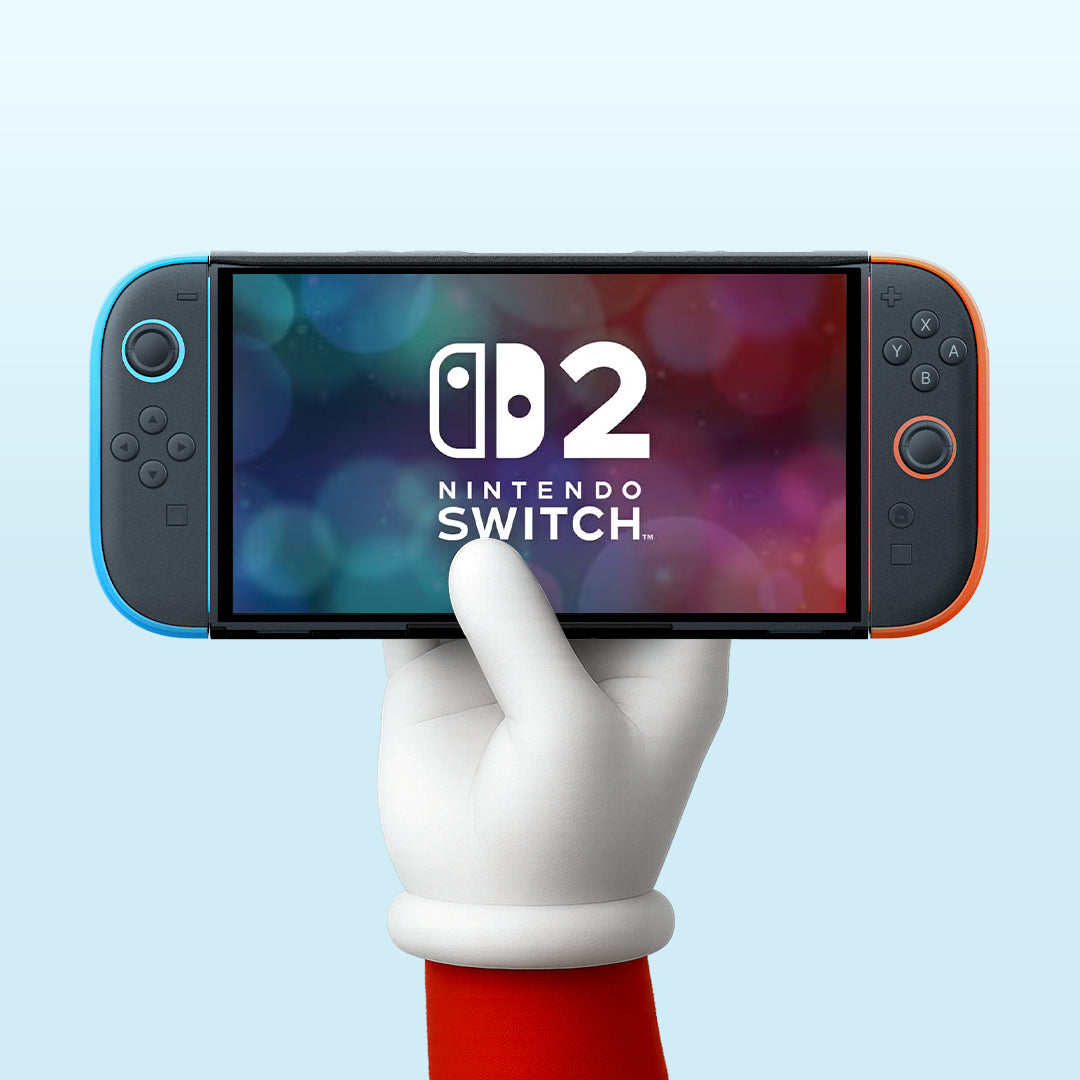 Showing the Nintendo Switch 2 with a pale blue background and held up with a white gloved hand