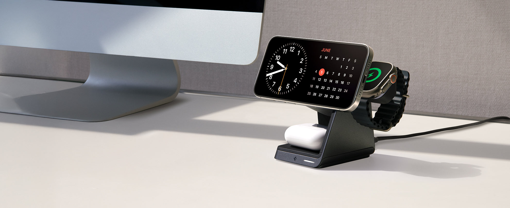 Desk with iPhone, AirPod, and Apple Watch on Spigen 3 in 1 charging stand