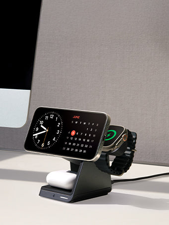 Desk with iPhone, AirPod, and Apple Watch on Spigen 3 in 1 charging stand