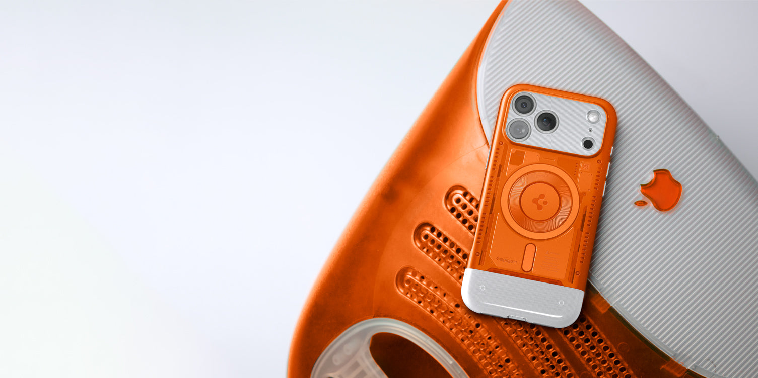Spigen iPhone 17 Pro Classic case in orange featuring MagSafe ring and retro translucent design displayed on vintage Apple hardware