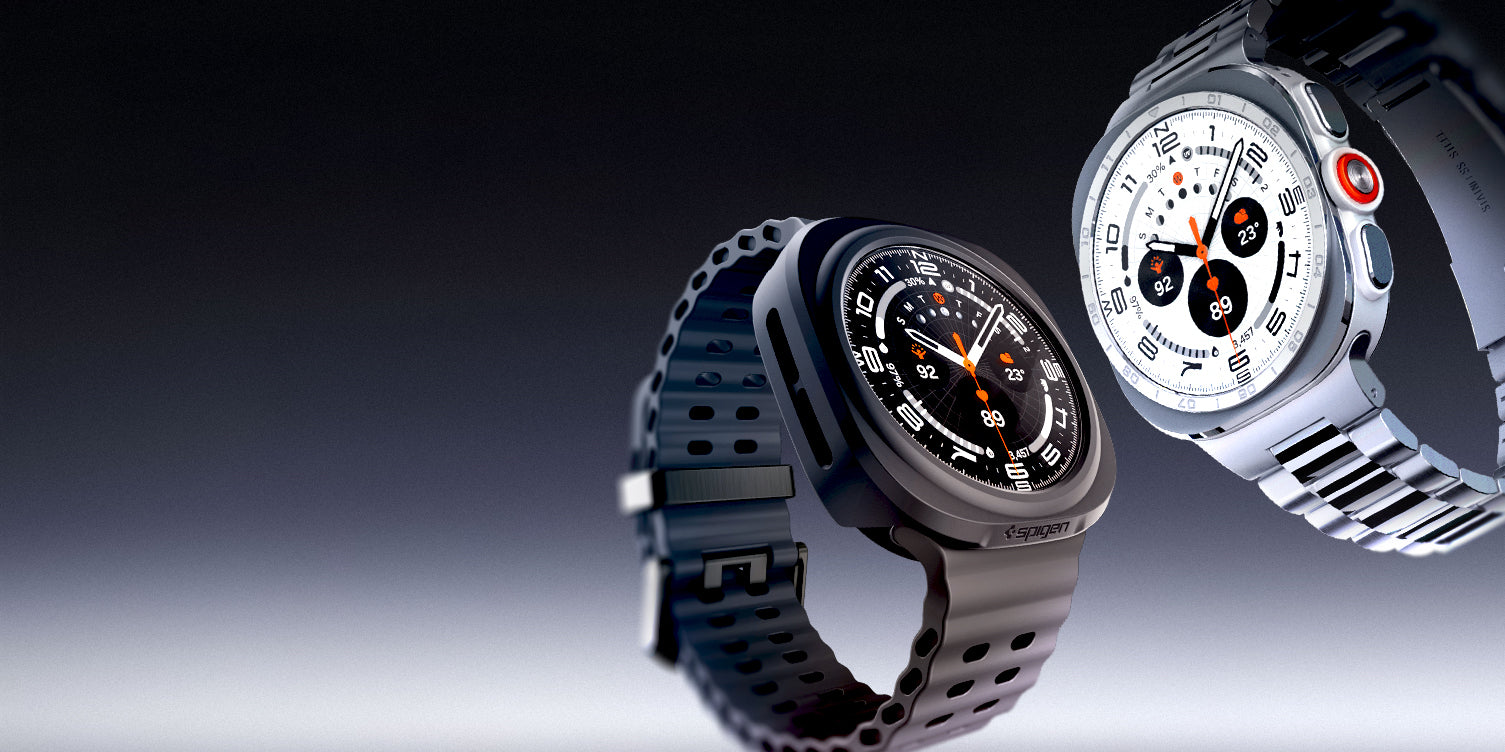 Two Samsung Galaxy Watch Ultra 2 with Spigen cases — one in black with rubber band, one in silver with metal band