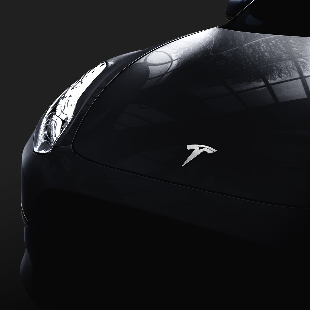 Showing the front of Tesla hood with the Tesla logo standing out