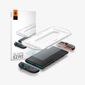 AGL09111 - Nintendo Switch 2 GLAS.tR EZ Fit in Clear showing the installation tray hovering above the film strip, screen protector and the device with the packaging on the side