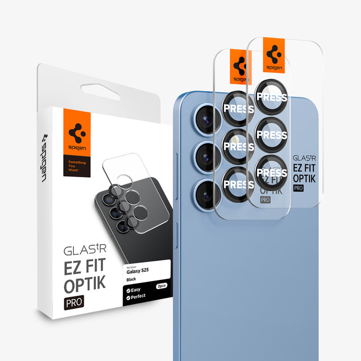 A blue phone with two camera lens protectors in front of it next to a white box