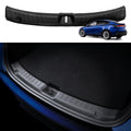 ACP09759 - Tesla Model Y Juniper Trunk Sill Guard | TG100-YJ in black showing a durable, textured protective trim installed along the rear trunk edge to prevent scratches and scuffs during loading and unloading.