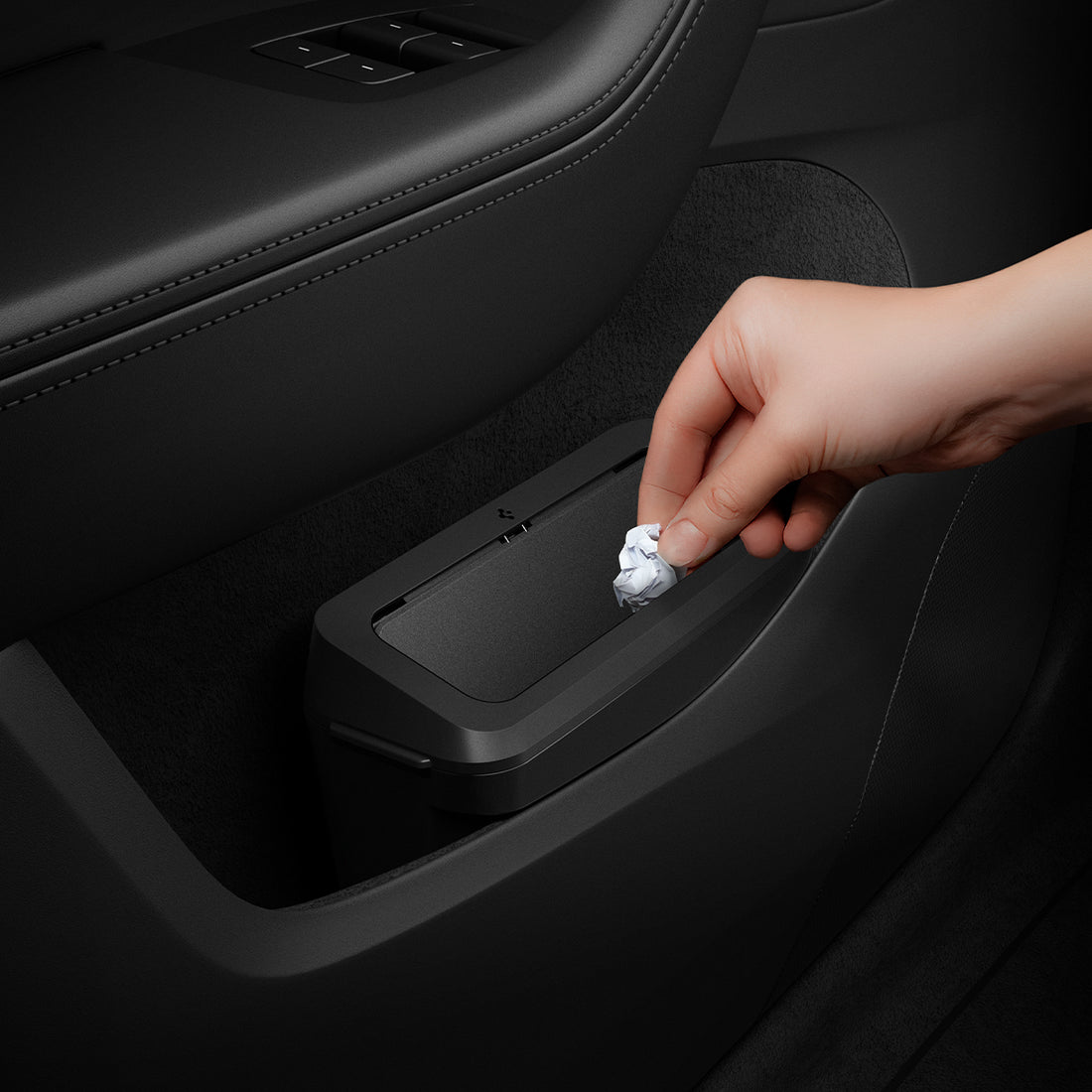 ACP11106 - Tesla Series - Car Trash Can | TO281J showing a compact trash bin installed in a Tesla door pocket as a hand drops a piece of crumpled paper into the lid.